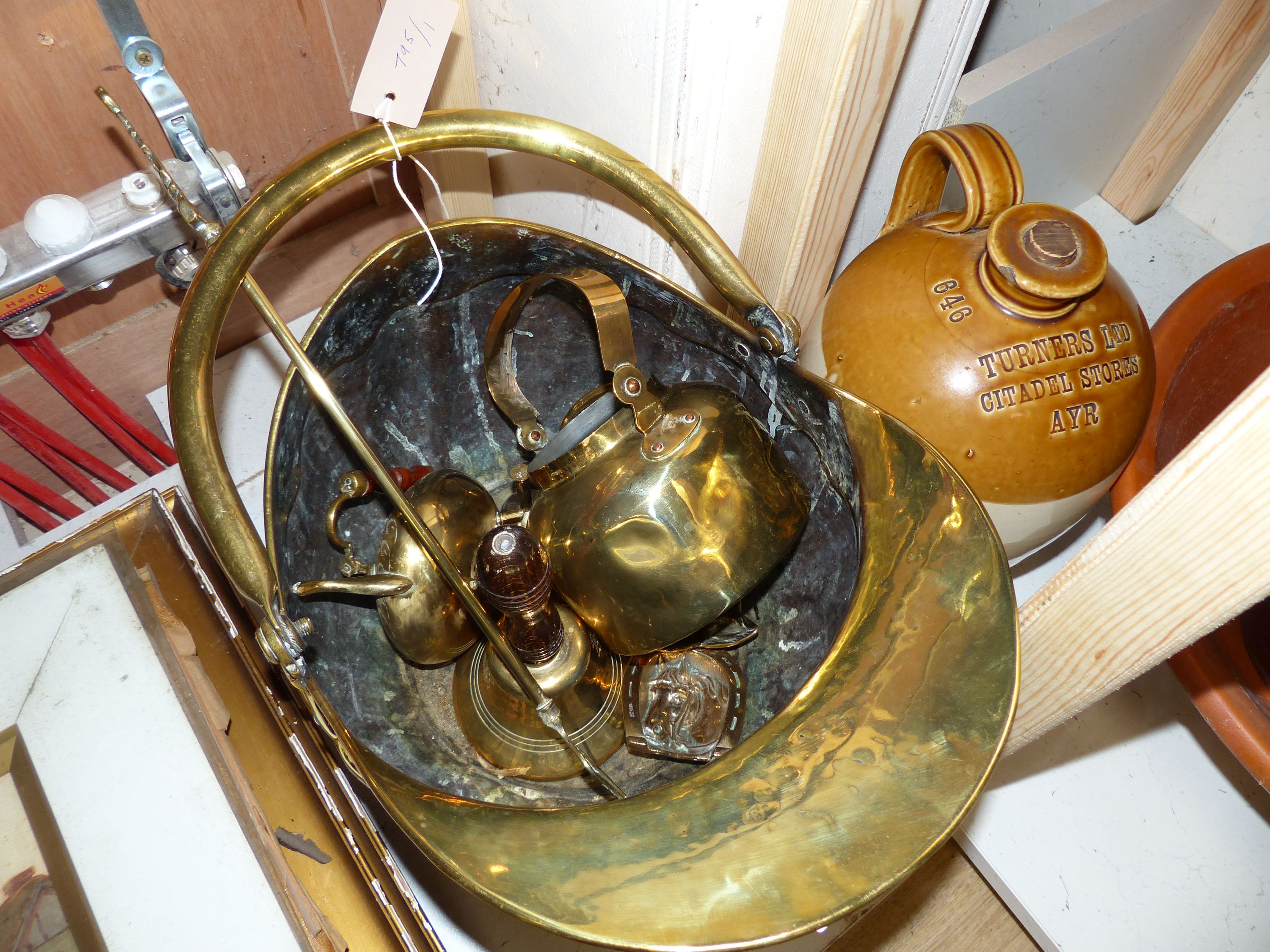 A Victorian helmet shaped coal scuttle and other metalware